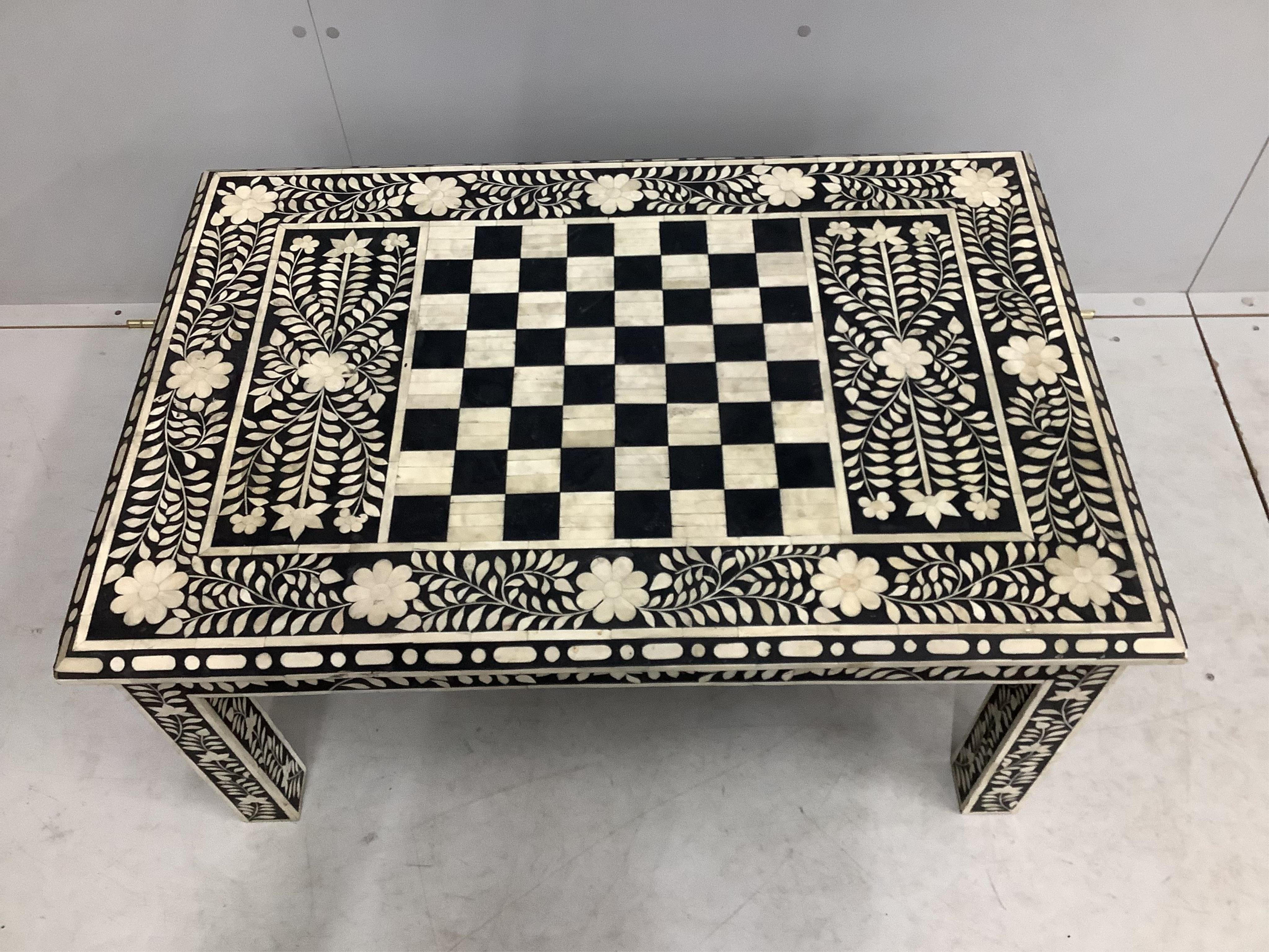 A rectangular faux ivory inlaid low games table, width 92cm, depth 42cm, height 36cm. Condition - fair to good.